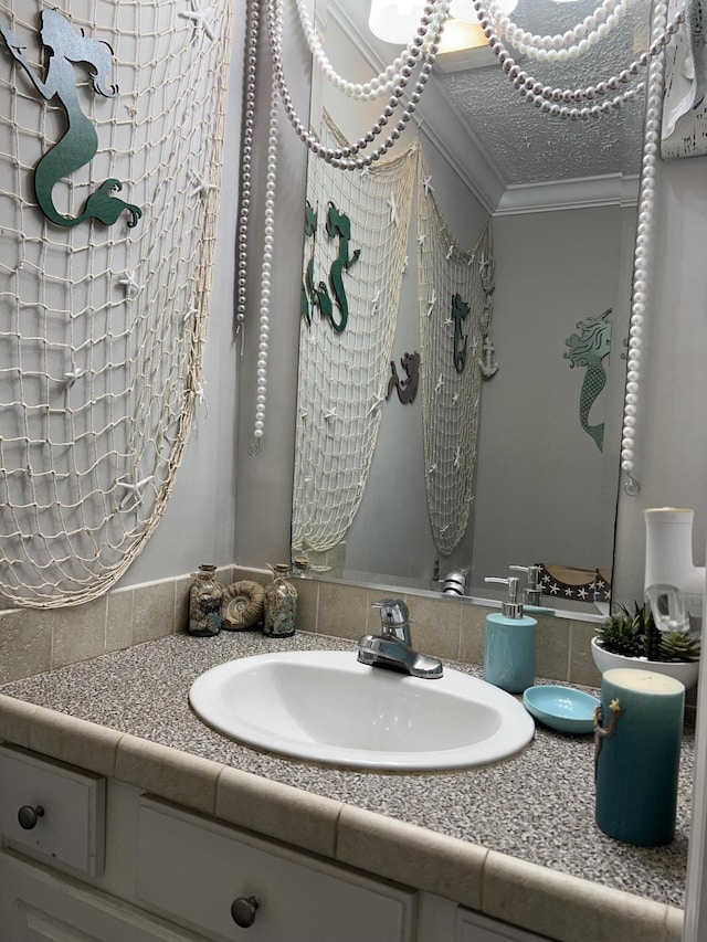 bathroom featuring vanity and ornamental molding