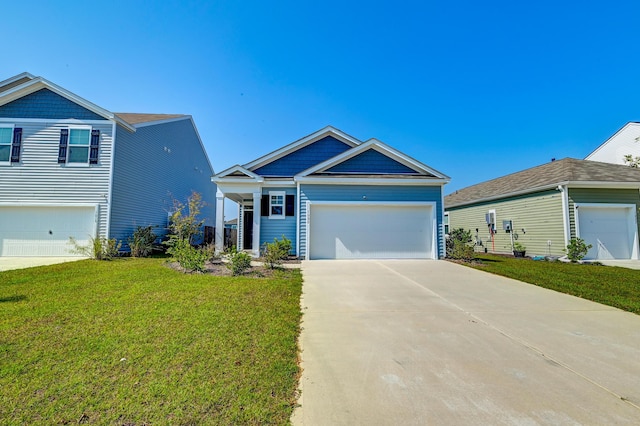 view of front of home featuring a front yard and a garage