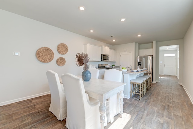 dining space featuring light wood-type flooring