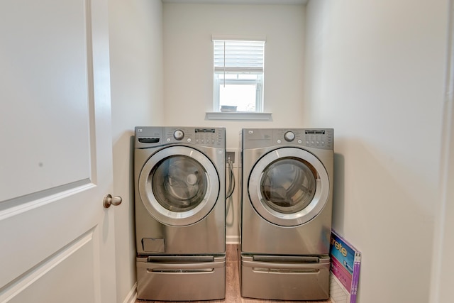 laundry room with washing machine and dryer