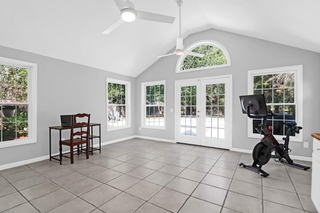 workout room with tile patterned flooring, french doors, a ceiling fan, baseboards, and vaulted ceiling