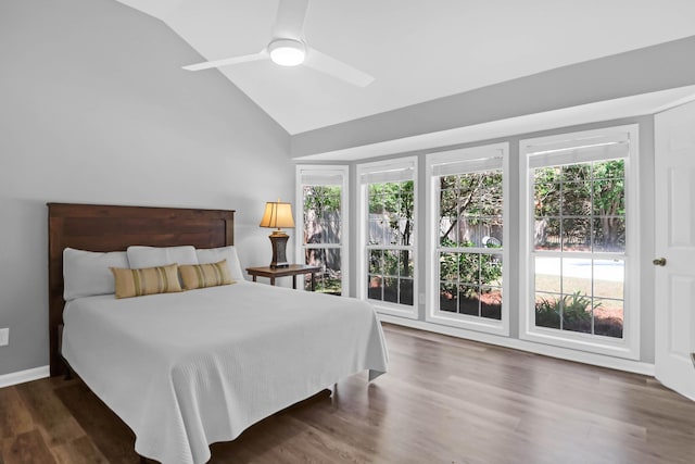 bedroom featuring ceiling fan, vaulted ceiling, and wood finished floors