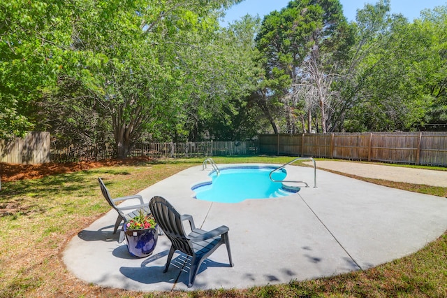 view of pool with a lawn, a patio, a fenced in pool, and a fenced backyard