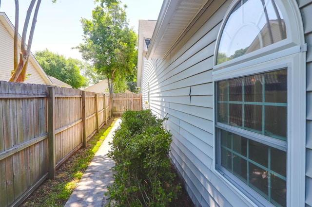 view of property exterior with fence
