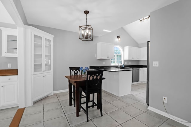 dining room featuring baseboards, vaulted ceiling, light tile patterned flooring, and a notable chandelier