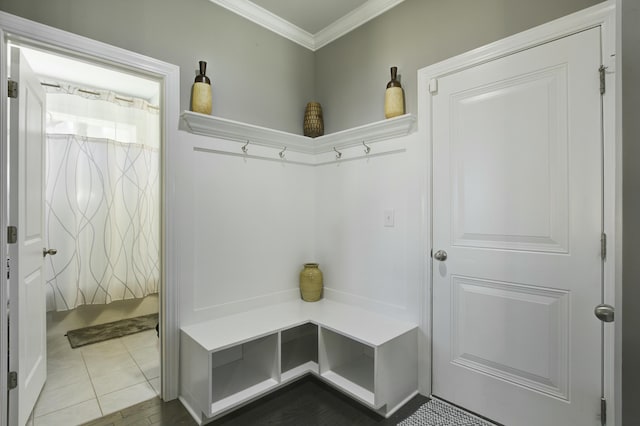 mudroom featuring crown molding and tile patterned flooring