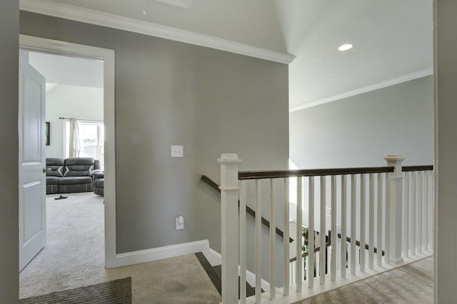 corridor with carpet flooring and crown molding