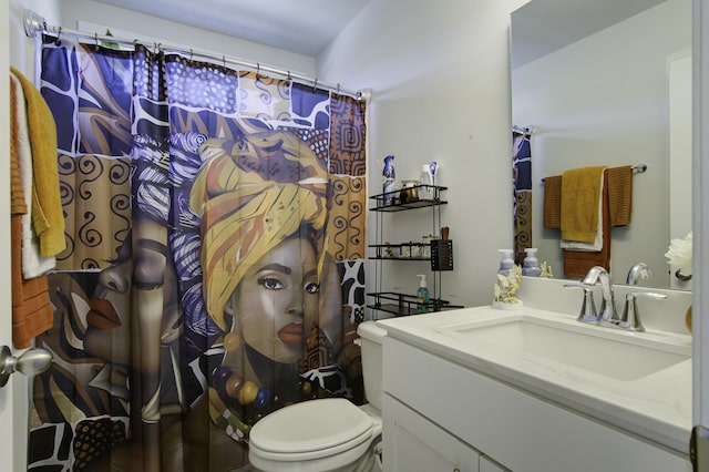 bathroom featuring vanity and toilet