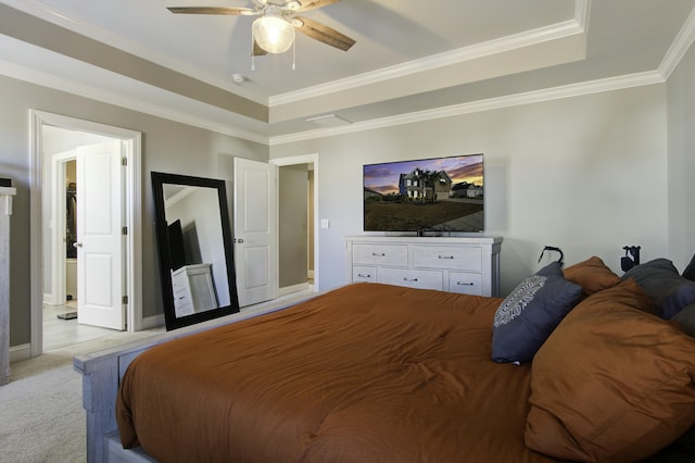 bedroom with ceiling fan, a raised ceiling, light colored carpet, and ornamental molding