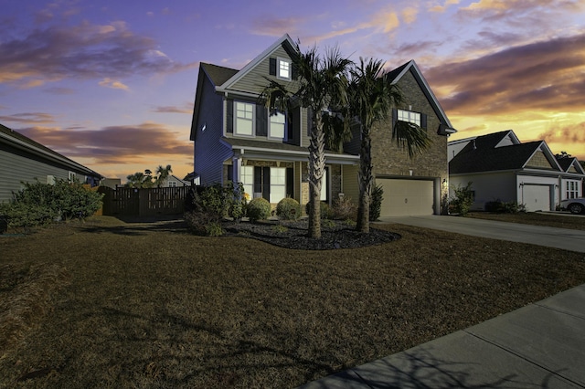 view of front facade with a lawn and a garage