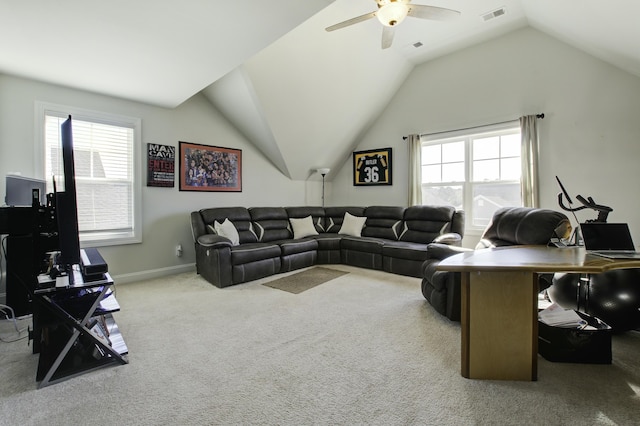 living room with ceiling fan, lofted ceiling, light carpet, and a wealth of natural light