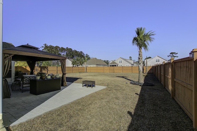 view of yard featuring a gazebo, an outdoor living space, and a patio