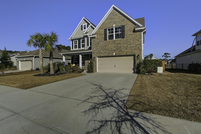 view of front of property featuring a garage and a front yard