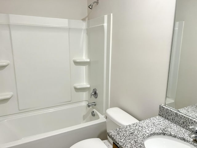 full bathroom featuring shower / bath combination, vanity, and toilet