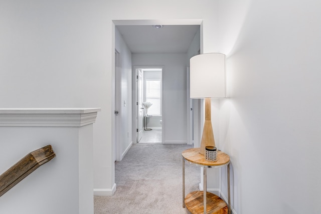 hallway with light carpet