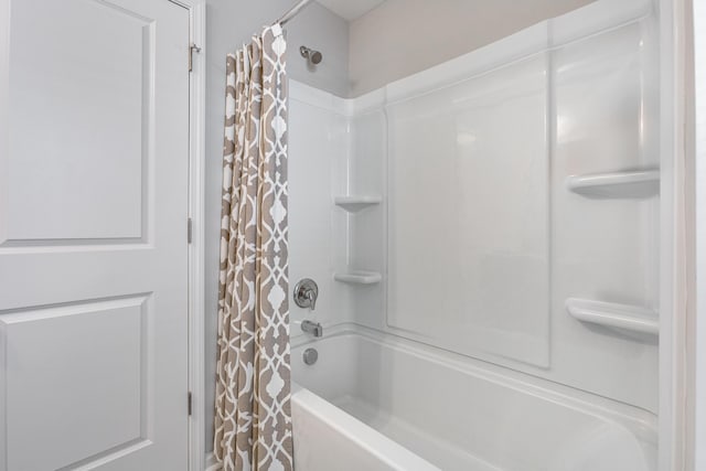 bathroom with shower / bathtub combination with curtain