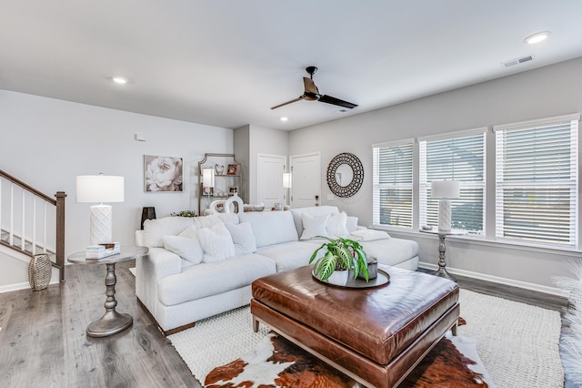 living room with hardwood / wood-style floors and ceiling fan