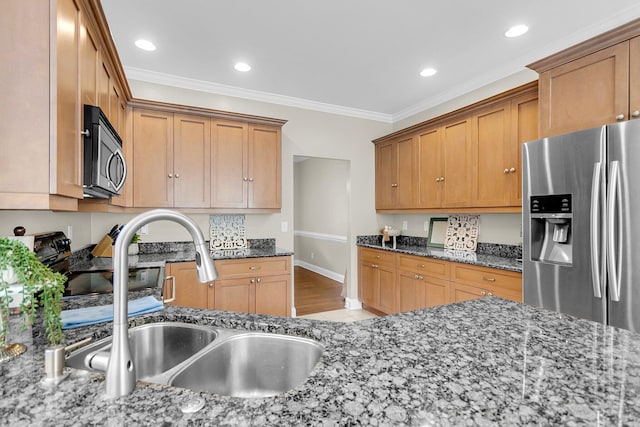 591 Two Mile Run, Johns Island, SC 29455 - kitchen featuring appliances with stainless steel finishes, crown molding, dark stone counters, recessed lighting, and brown cabinets
