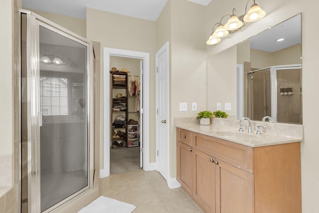 591 Two Mile Run, Johns Island, SC 29455 - bathroom featuring vanity, a stall shower, a walk in closet, and tile patterned flooring