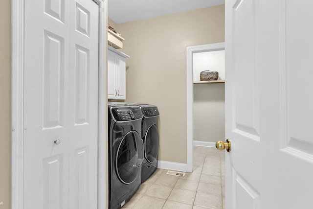 591 Two Mile Run, Johns Island, SC 29455 - laundry area with washing machine and dryer, light tile patterned flooring, and cabinet space