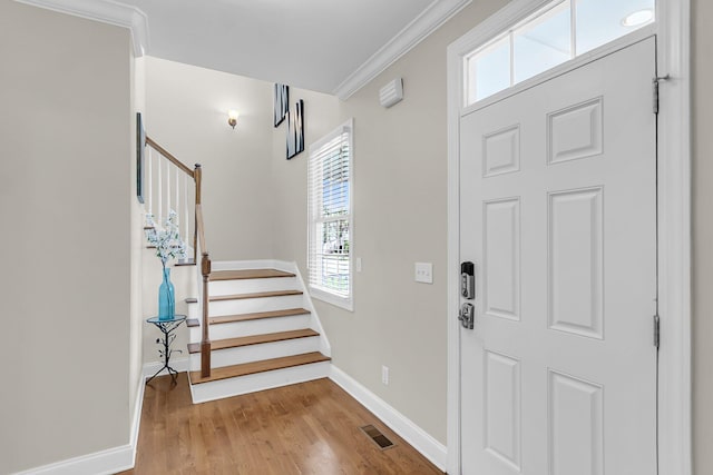 591 Two Mile Run, Johns Island, SC 29455 - entrance foyer featuring stairs, wood finished floors, and ornamental molding