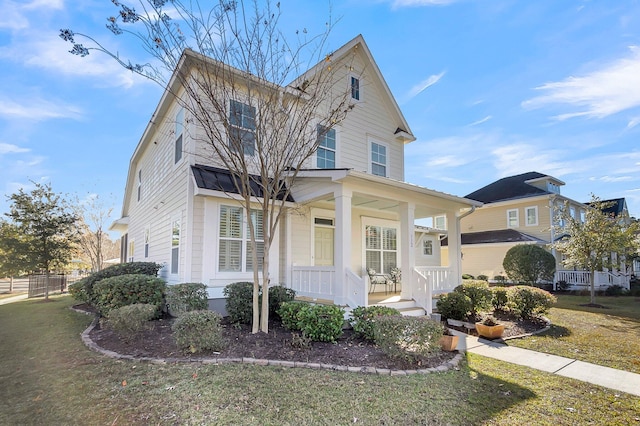 front of property featuring a front lawn and a porch