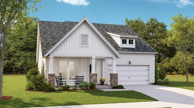 view of front facade with a porch, a garage, and a front yard