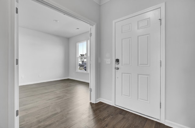 entrance foyer with dark hardwood / wood-style floors