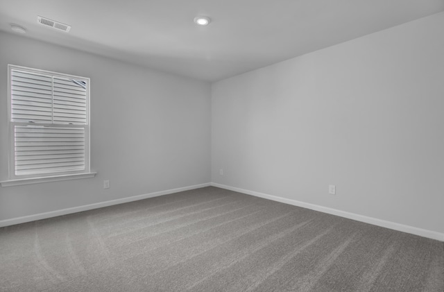 unfurnished room featuring carpet flooring