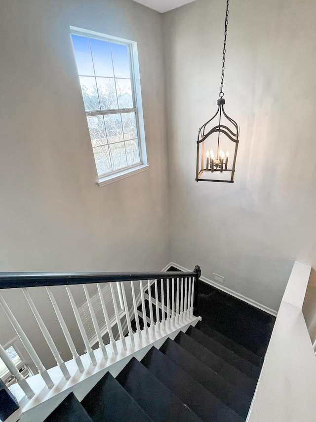 stairway featuring baseboards