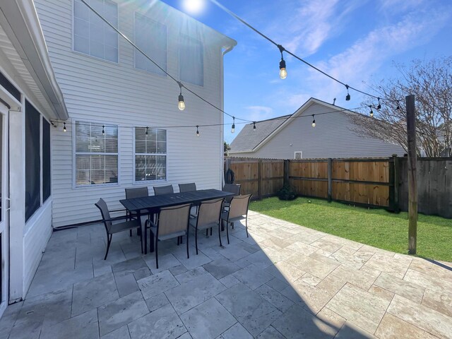 view of patio with a fenced backyard and outdoor dining area