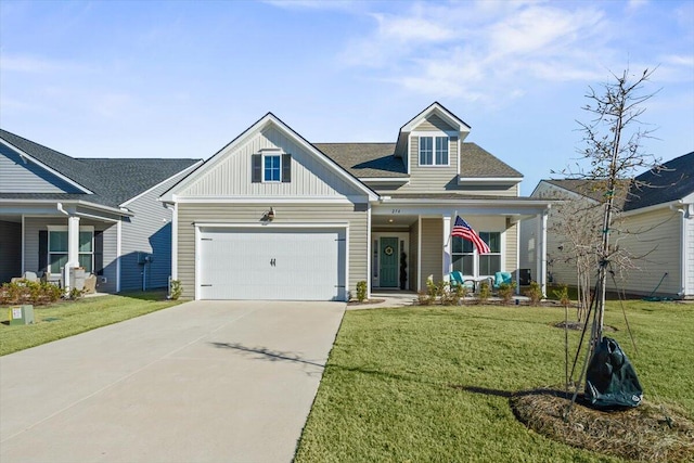 view of front of home featuring a front lawn, a garage, and a porch