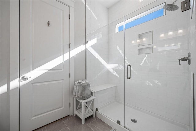 bathroom featuring walk in shower and tile patterned floors