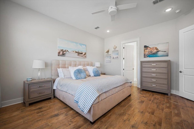 bedroom with ceiling fan and dark hardwood / wood-style floors