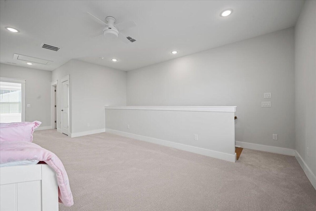 unfurnished bedroom with light colored carpet and ceiling fan