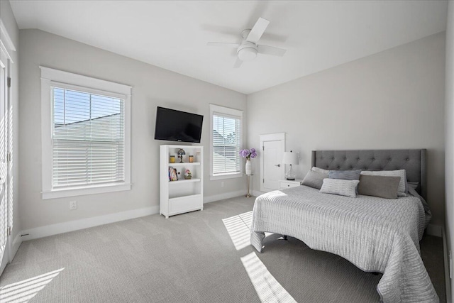 bedroom with ceiling fan and light colored carpet