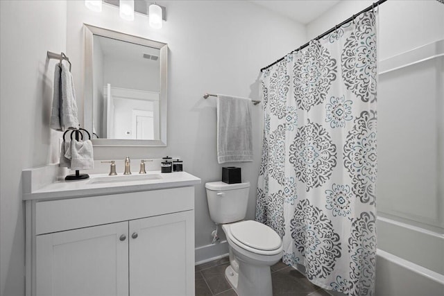 full bathroom with tile patterned floors, shower / tub combo with curtain, vanity, and toilet