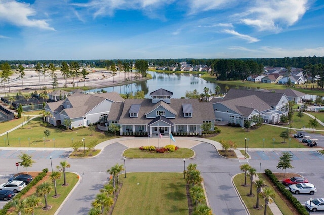 birds eye view of property with a water view