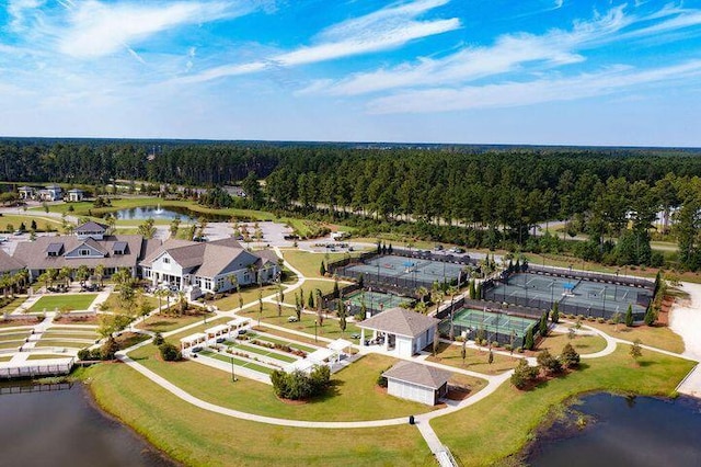 birds eye view of property with a water view