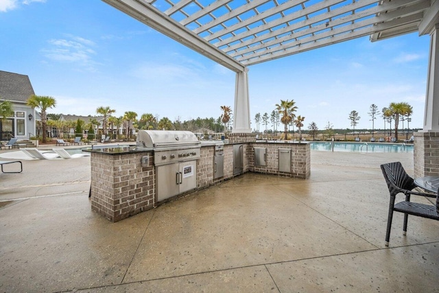 view of patio / terrace featuring a community pool, exterior kitchen, a pergola, and a grill