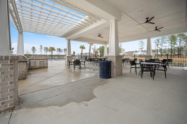 view of patio / terrace featuring ceiling fan, a pergola, and area for grilling