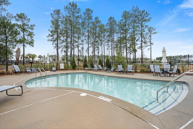 view of swimming pool with a patio