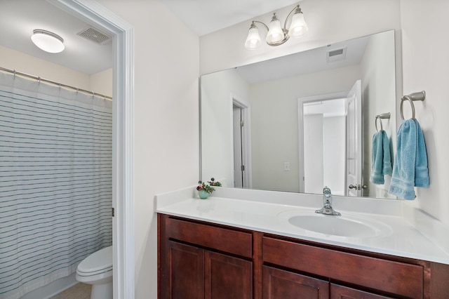 full bathroom featuring vanity and toilet