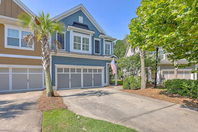 2036 Kings Gate Ln, Mount Pleasant, SC 29466 - traditional home featuring concrete driveway, a garage, and board and batten siding