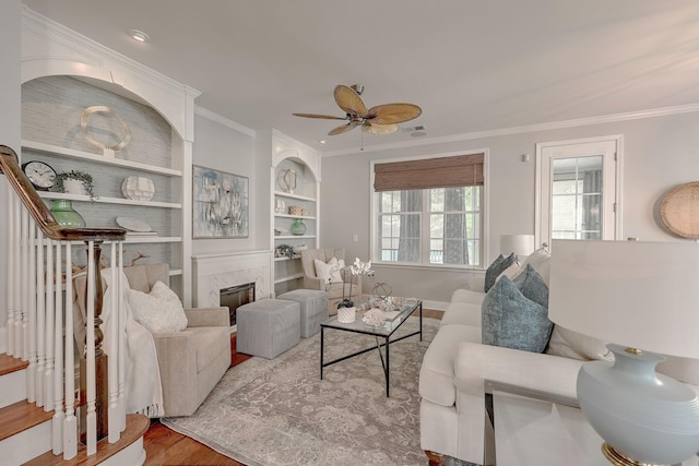 2036 Kings Gate Ln, Mount Pleasant, SC 29466 - living area featuring wood finished floors, crown molding, built in features, a ceiling fan, and a fireplace