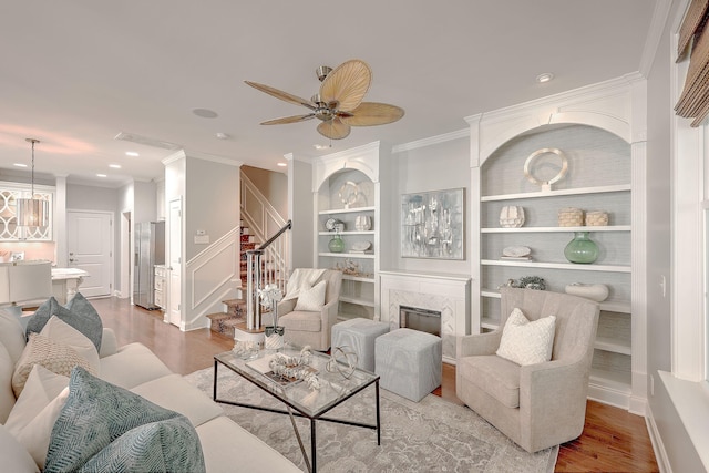 2036 Kings Gate Ln, Mount Pleasant, SC 29466 - living area with wood finished floors, stairway, ornamental molding, a fireplace, and recessed lighting