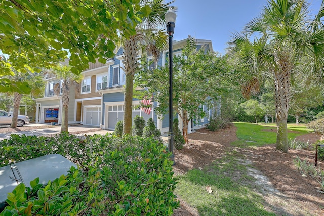 2036 Kings Gate Ln, Mount Pleasant, SC 29466 - view of front of property with an attached garage, board and batten siding, and driveway