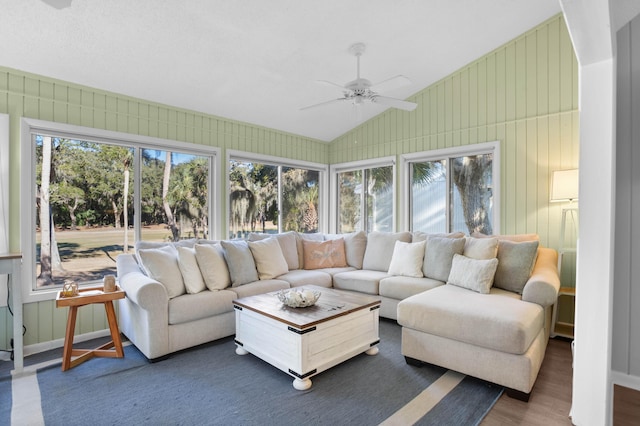 sunroom featuring lofted ceiling, a wealth of natural light, and ceiling fan