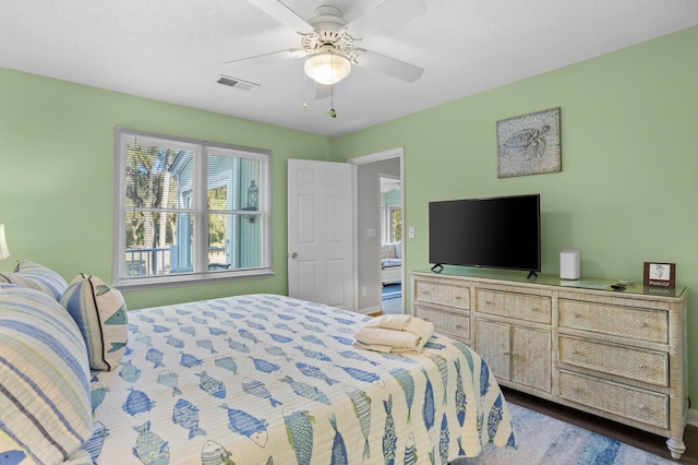 bedroom featuring ceiling fan and dark hardwood / wood-style floors