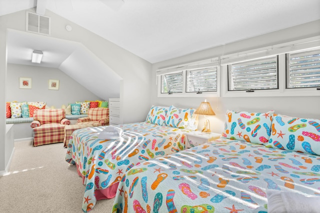 bedroom featuring lofted ceiling and carpet floors